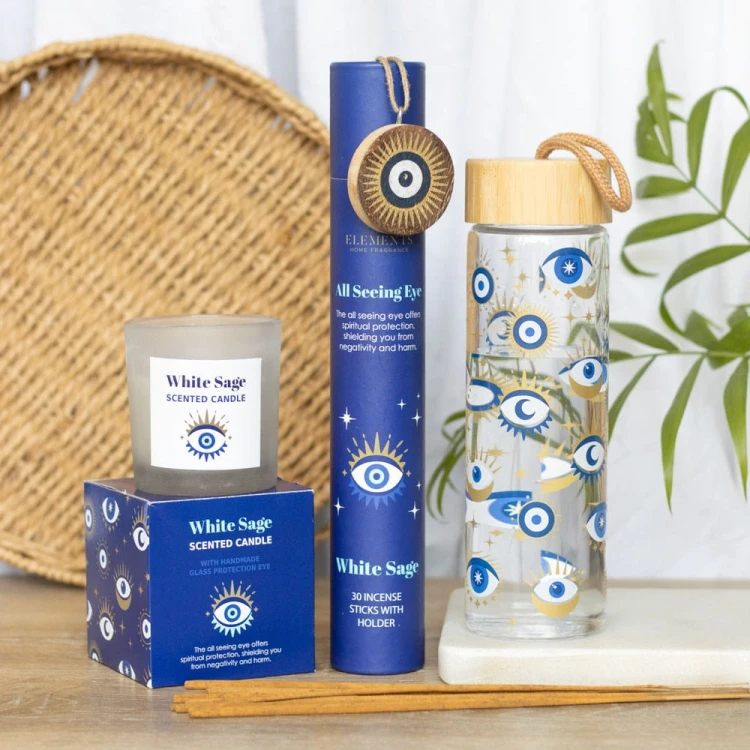 Zestaw All Seeing Eye z kadzidłami, świecą i butelką w ochronne motywy oka – rytualna harmonia i duchowa tarcza.