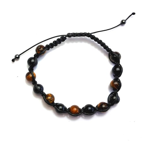 Bransoletka z naturalnym Tygrysim Okiem na czarnej regulowanej plecionce. Ręcznie wykonana w Polsce. Amulet odwagi, siły i ochrony – wspiera pewność siebie i chroni aurę przed negatywnymi wpływami.