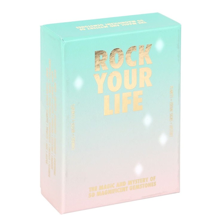 Talia kart Rock Your Life – zestaw 40 kart z ilustracjami kamieni szlachetnych i opisami ich właściwości energetycznych, w pastelowym pudełku z napisem złotą czcionką.