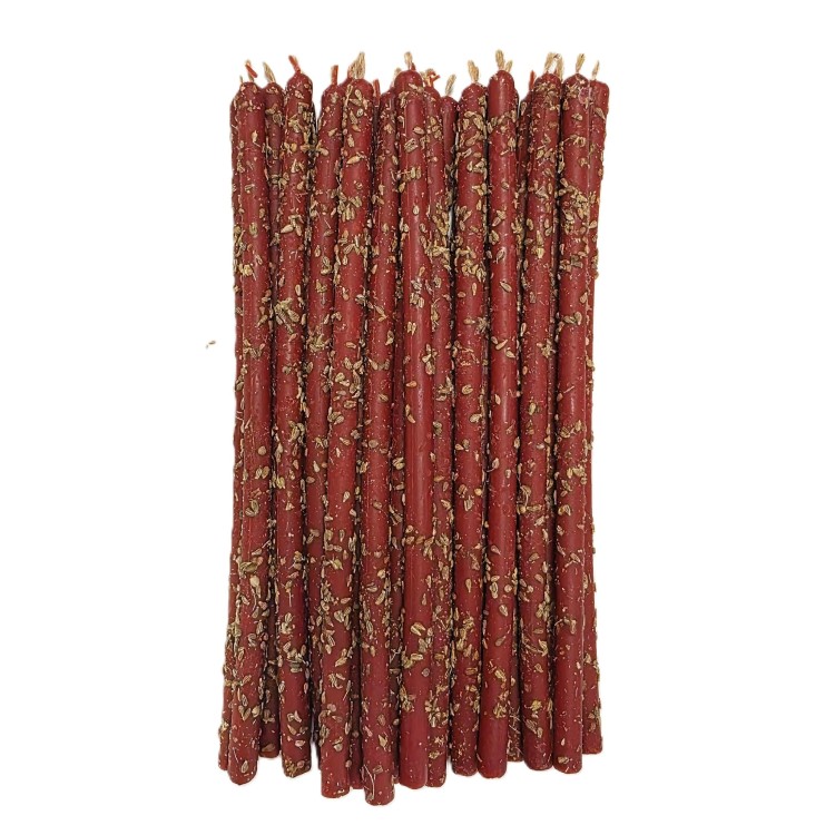 Ręcznie wykonana czerwona świeca rytualna pokryta anyżem — świeca ochronna dla domu.