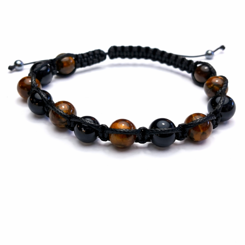 Bransoletka z naturalnym Tygrysim Okiem na czarnej regulowanej plecionce. Ręcznie wykonana w Polsce. Amulet odwagi, siły i ochrony – wspiera pewność siebie i chroni aurę przed negatywnymi wpływami.