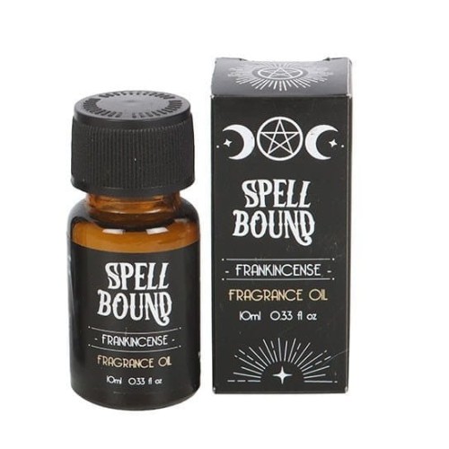 Olejek zapachowy Spell Bound Frankincense z kolekcji Midnight Rituals – flakon i czarne opakowanie z symbolem pentagramu i księżyca.